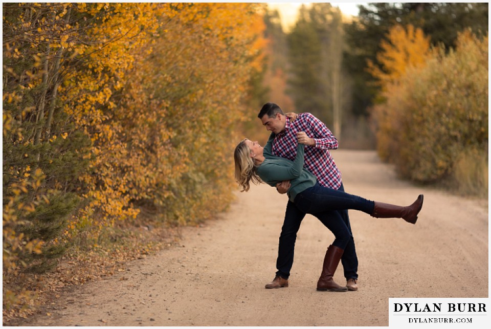 colorado mountain engagement session dancing in an open road