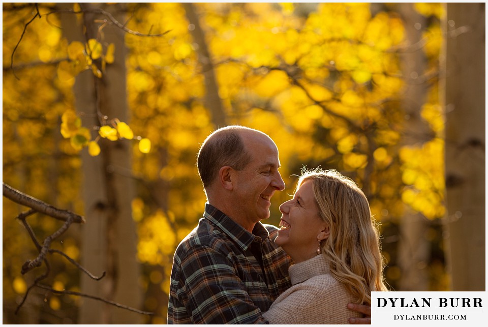 colorado engagement session in mountains laughing together