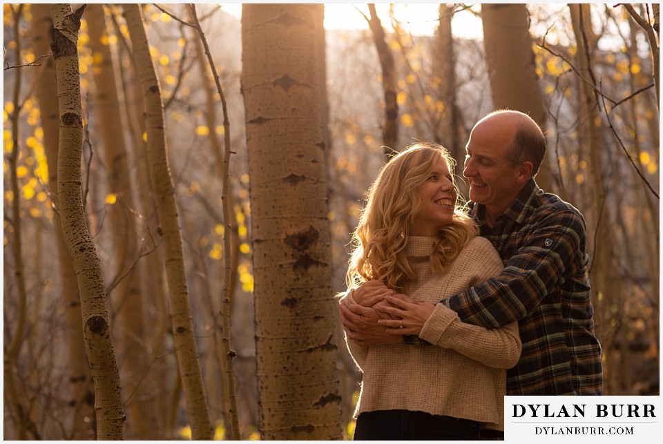 colorado engagement session in mountains holding each other at sunset