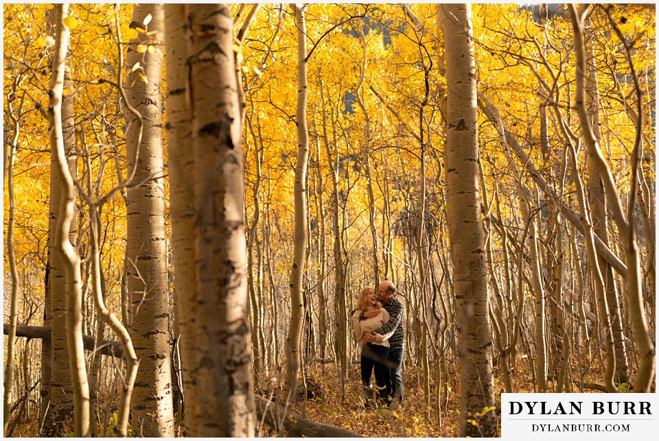 colorado engagement session in mountains surrounded by gold aspen trees