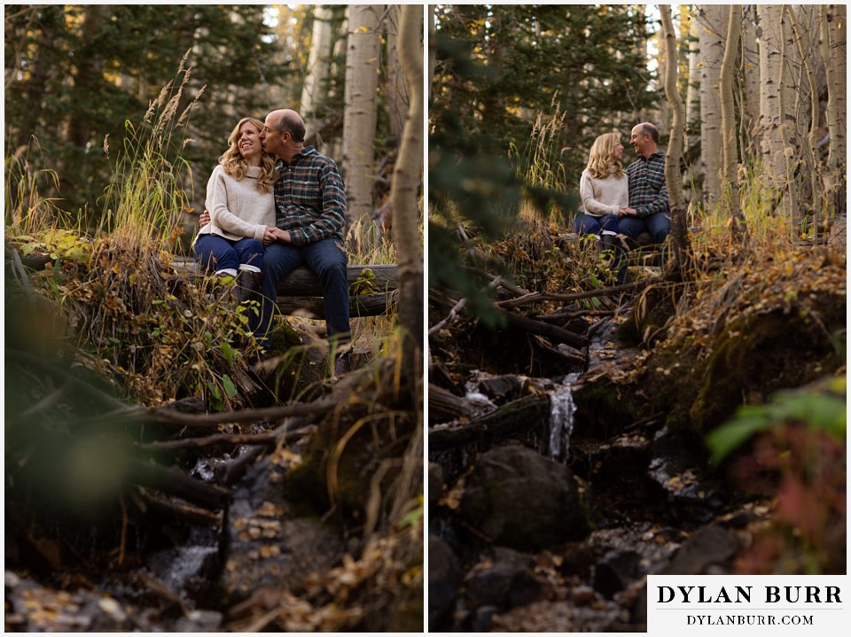 colorado engagement session in mountains couple over river creek in mountains