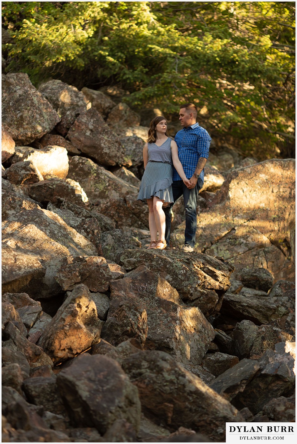 golden colorado mountain enagagement photo session couple surrounded by giant boulders