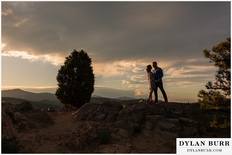 golden colorado mountain enagagement photo session sunset mountain top of engaged couple