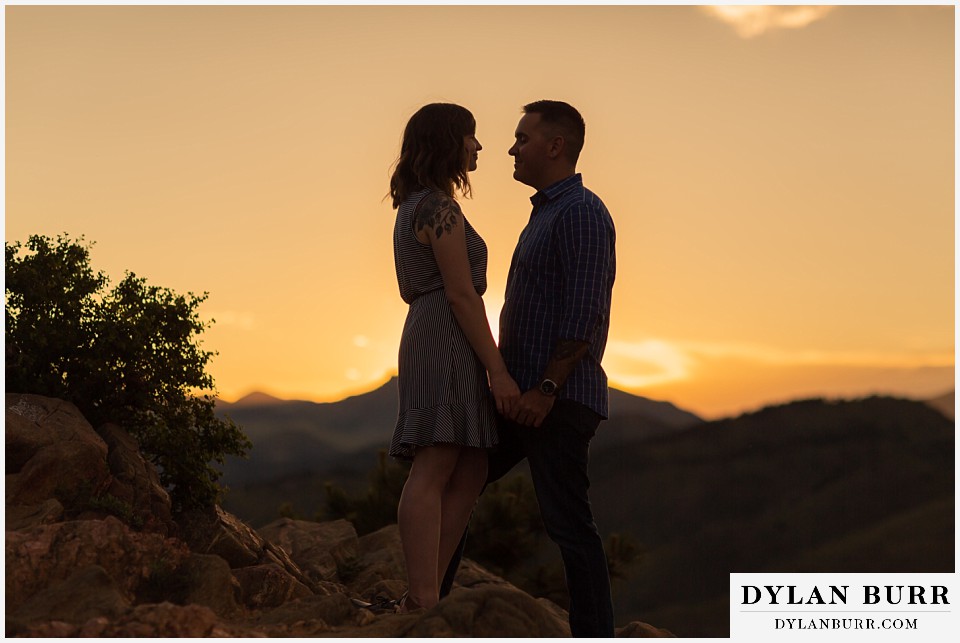 golden colorado mountain enagagement photo session couple enjoying each other at sunset