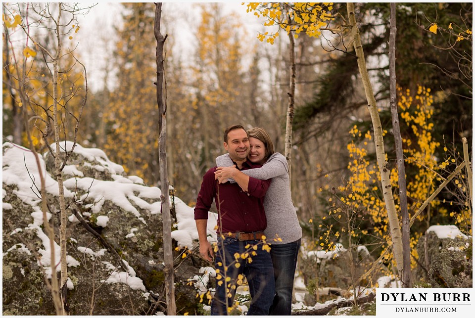 colorado mountain engagement session yellow aspen tree leaves snow