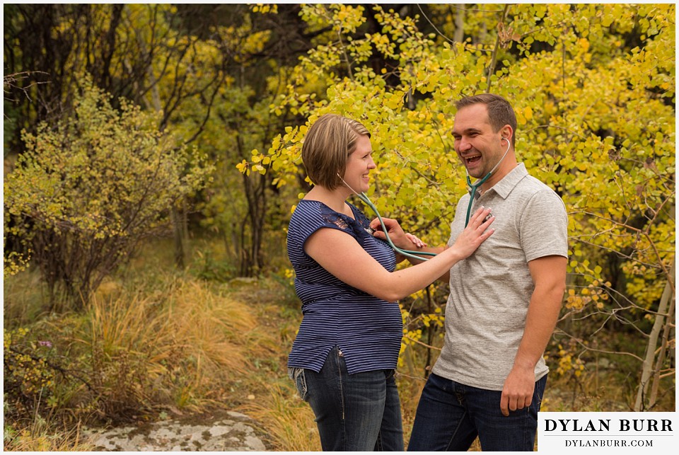 colorado mountain engagement session nurses listening to eachother hearts fall colorado afternoon aspen trees