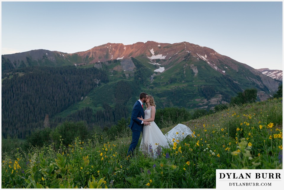 crested butte wedding elopement first kiss in mountain wildflowers
