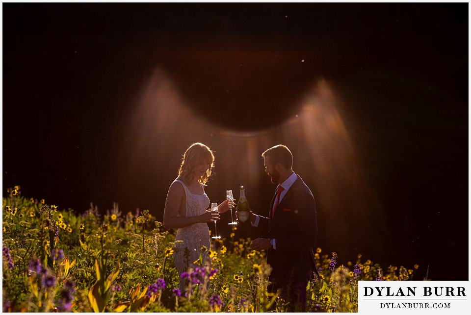 crested butte wedding elopement champagne toast at sunrise in the wildflowers