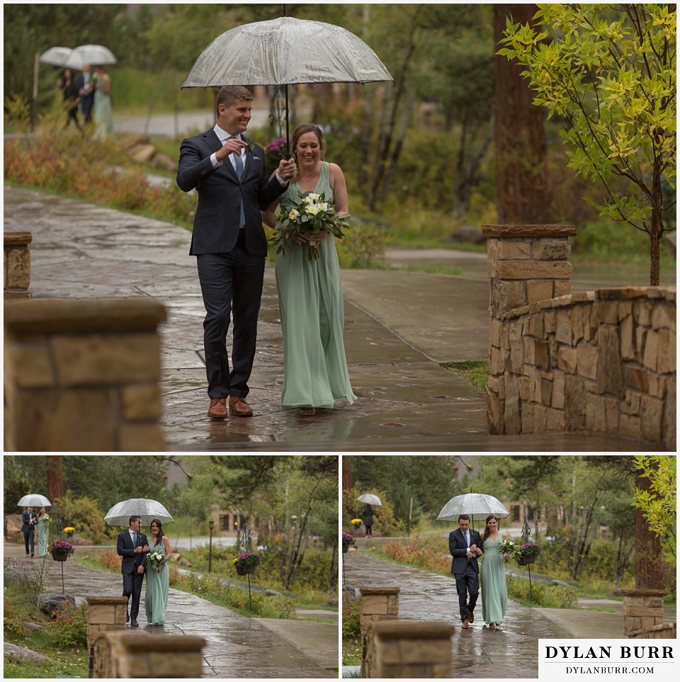 della terra wedding estes park colorado mountain wedding bridal party with umbrellas entering ceremony site