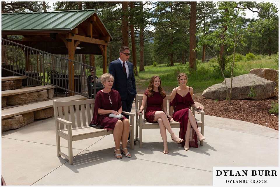 della terra mountain chateau wedding colorado rocky mountain national park wedding rmnp elopement bridesmaids are seated and waiting for the bride