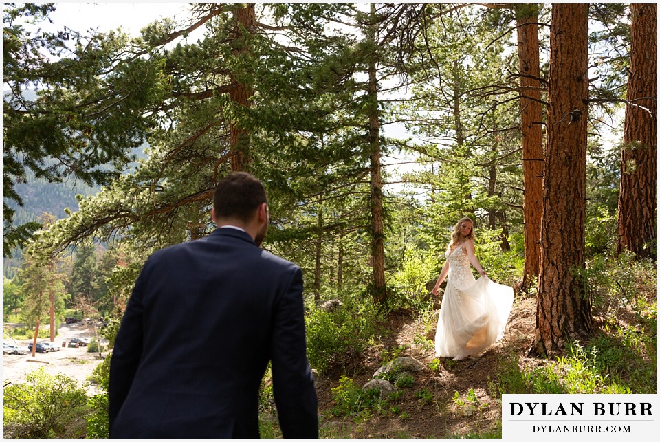 della terra mountain chateau wedding colorado rocky mountain national park wedding rmnp elopement groom walks up to his wife in mountains