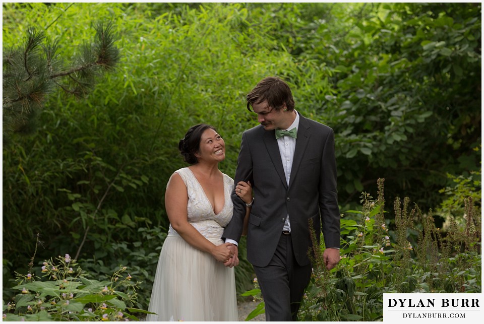denver botanic gardens wedding colorado woodland mosaic bride groom walking hand in hand