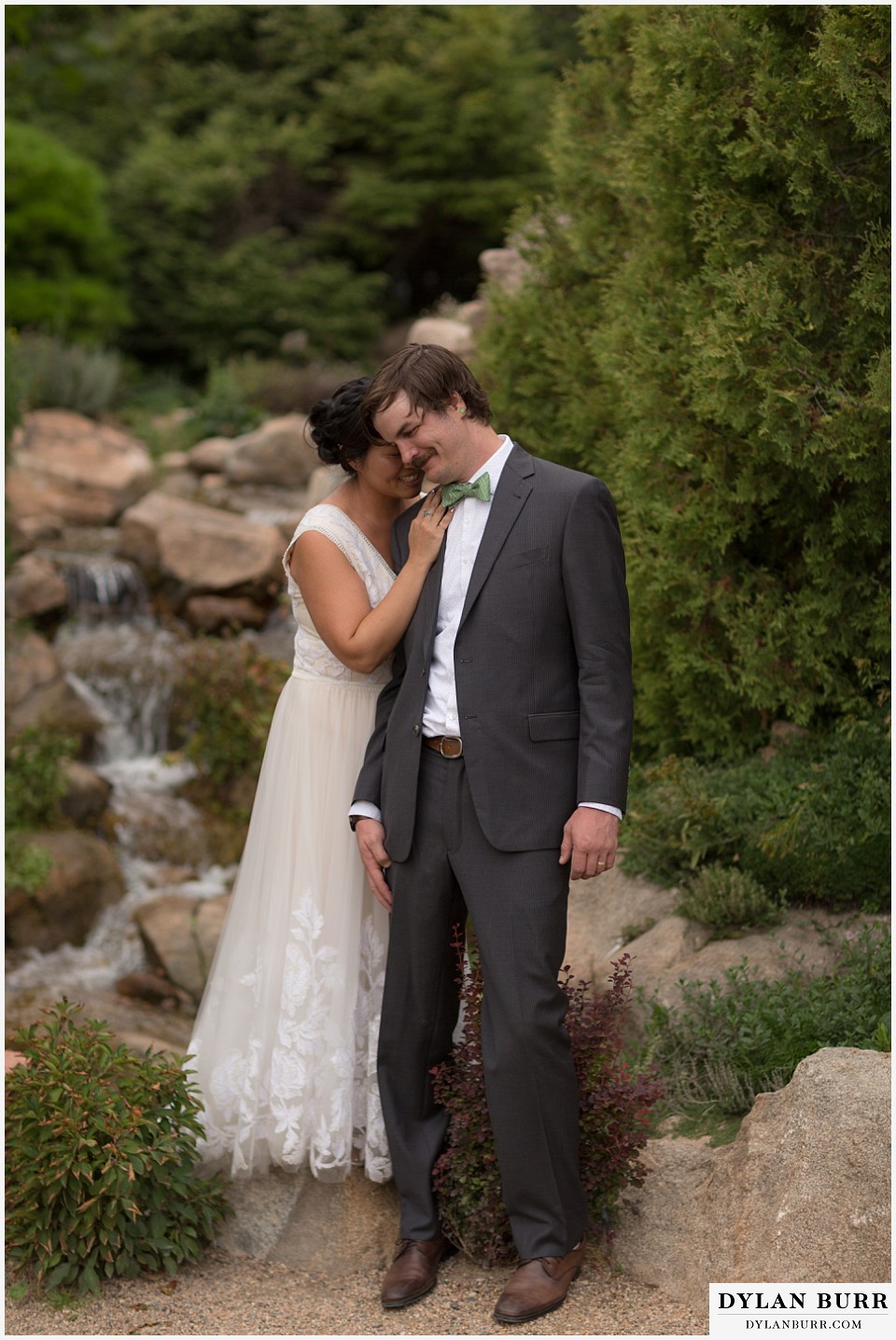 denver botanic gardens wedding colorado woodland mosaic bride groom whispering by a waterfall