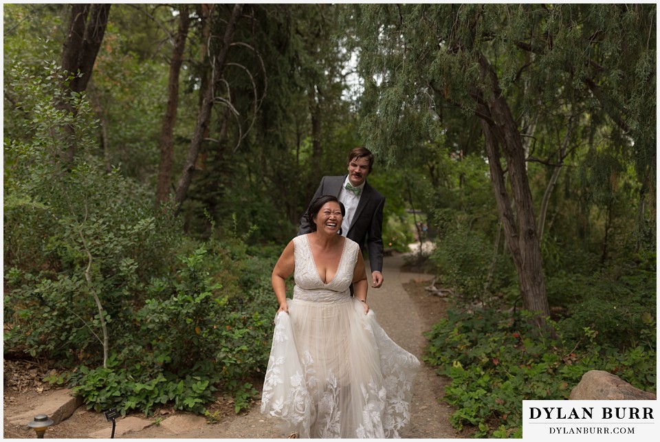 denver botanic gardens wedding colorado woodland mosaic bride groom skipping and laughing