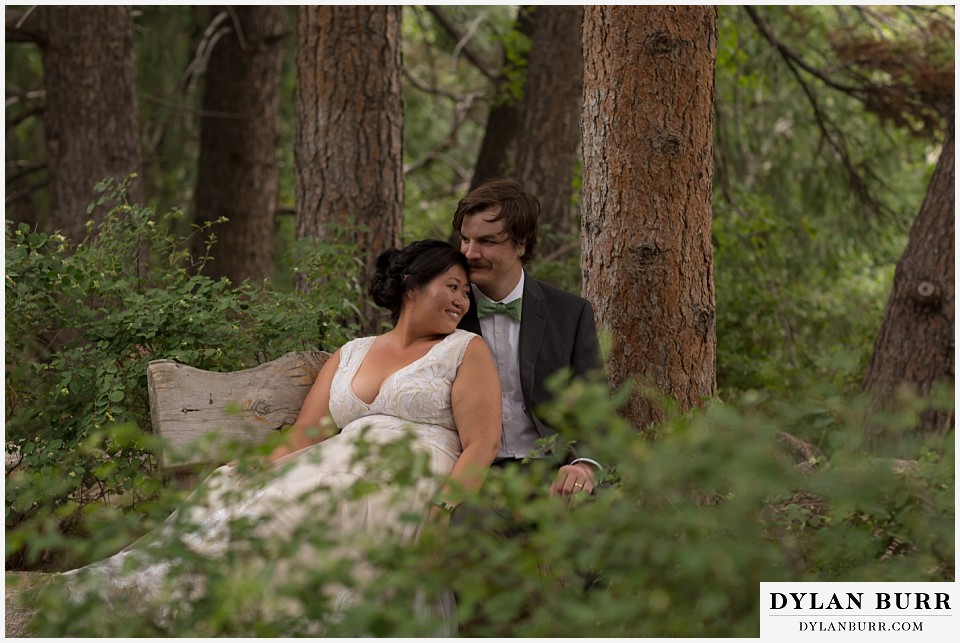 denver botanic gardens wedding colorado woodland mosaic bride groom sitting on bench