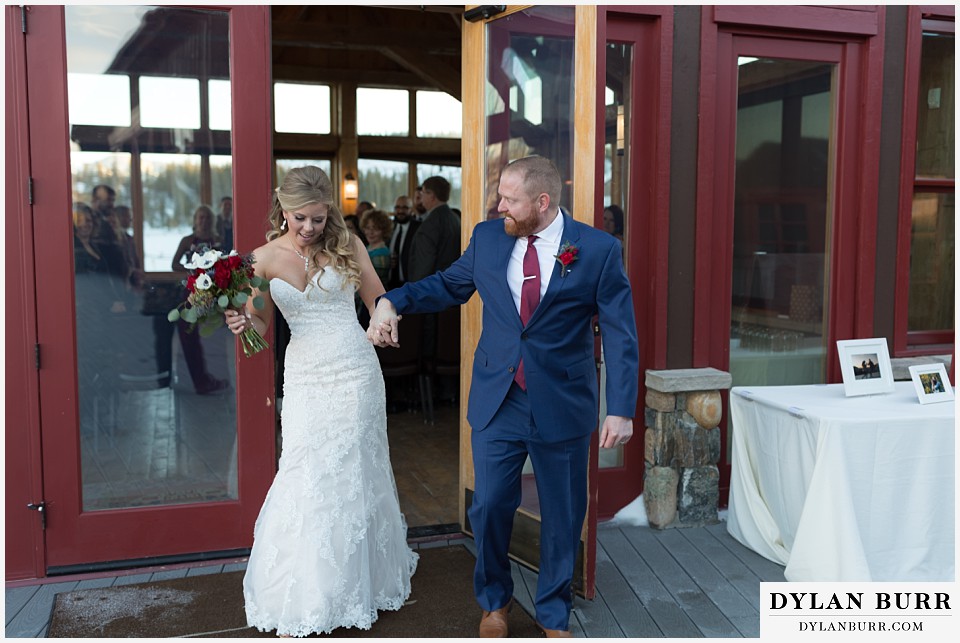 devils thumb ranch wedding in winter ceremony timber house happy dance