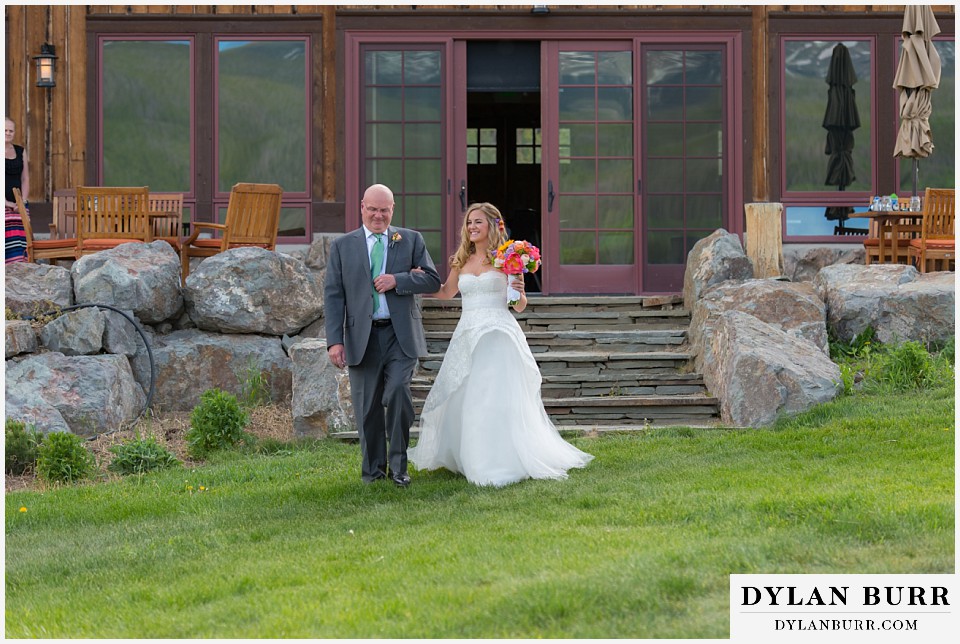 devils thumb ranch wedding bride walking with father