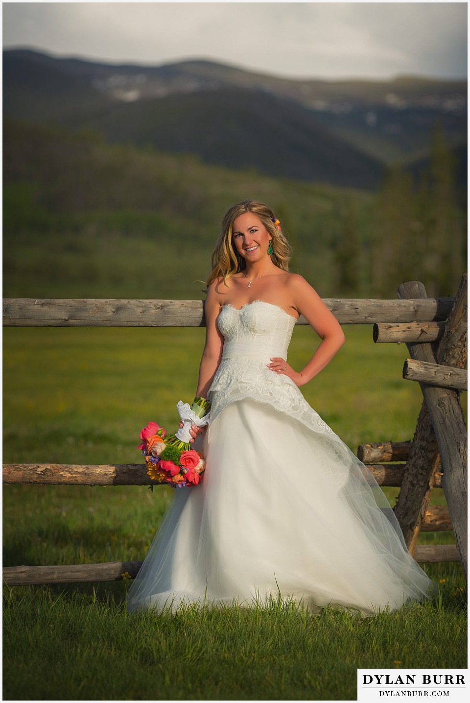 devils thumb ranch wedding bride standing alone with mountain valley begind her
