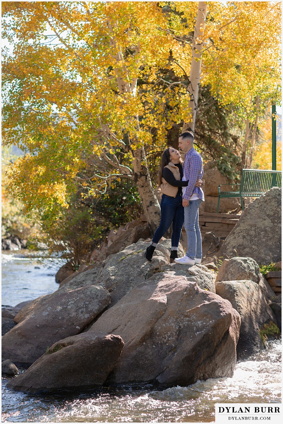 downtown estes park engagement photos singing to her groom