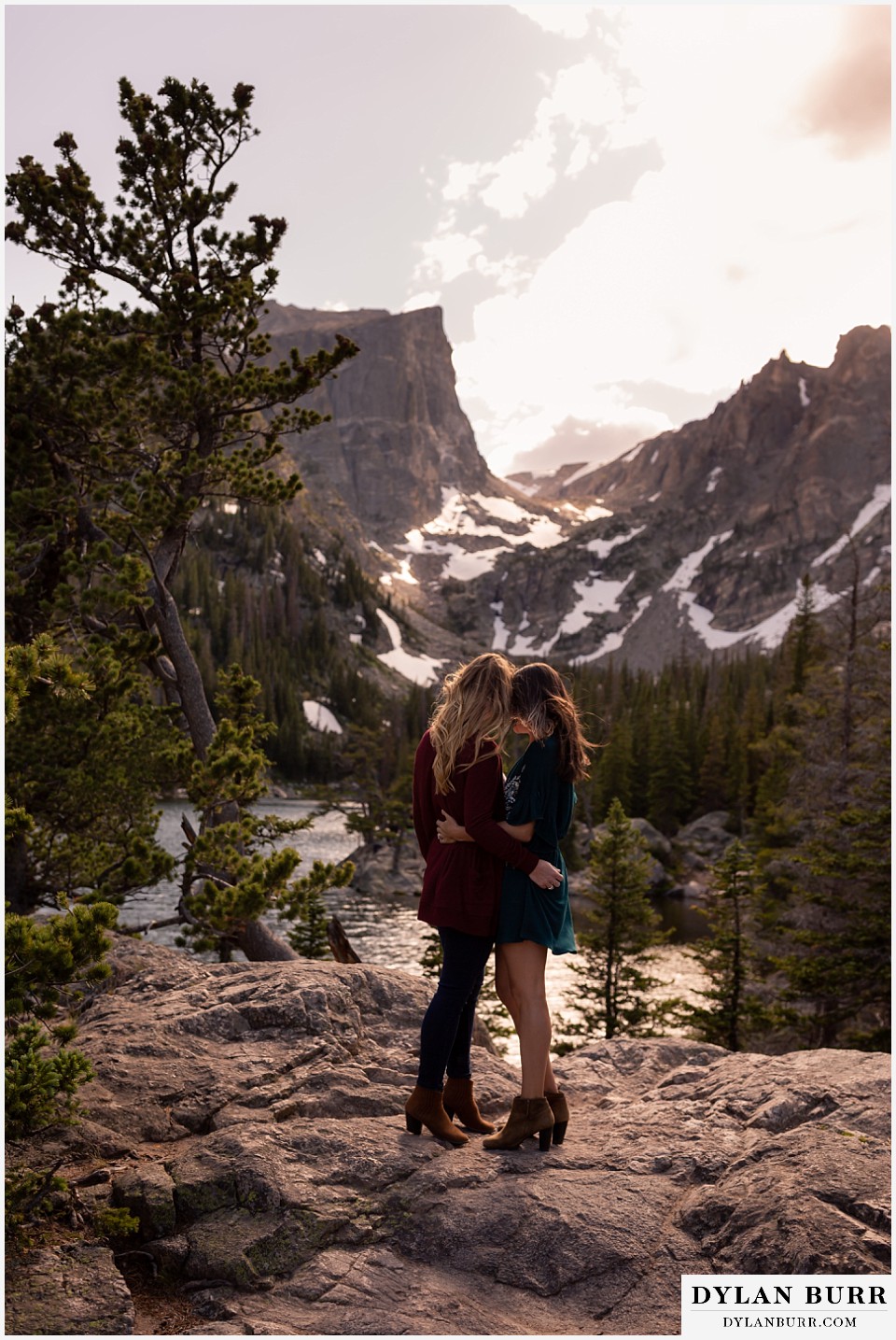 estes park engagement photos couple hugging in close high up in mountains