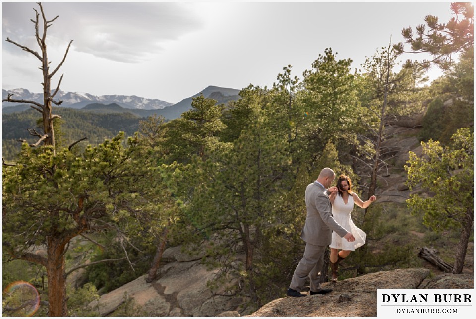 rocky mountain estes park engagement session rock climbing in white dress