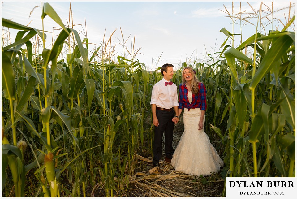 fall anniversary photos laughing together in corn field maze