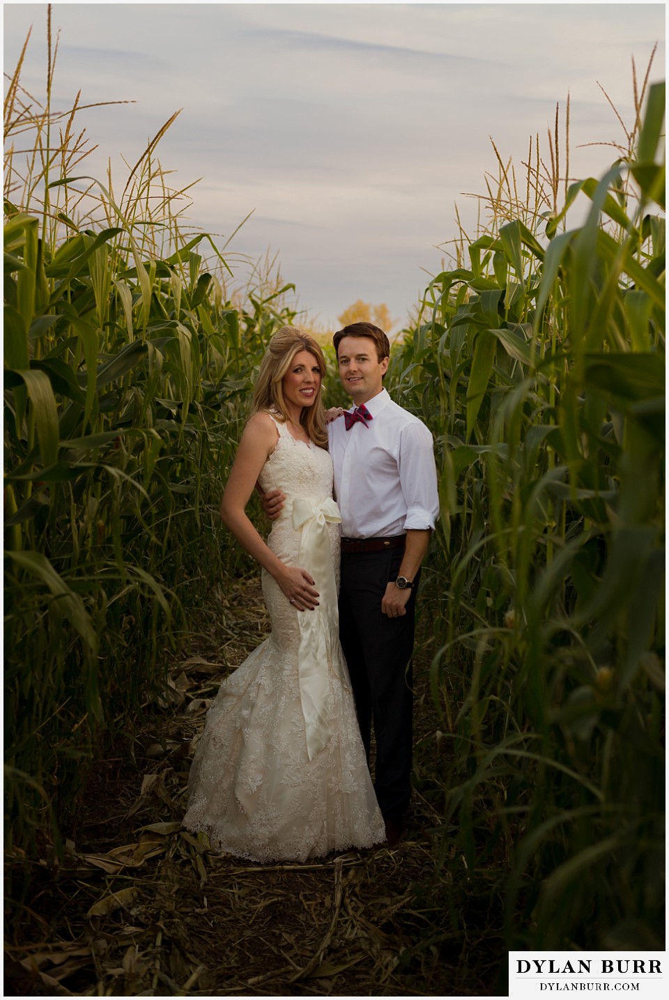 fall anniversary photos bride and groom together in corn maze