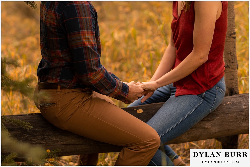 fall engagement photos in colorado close up of couple holding hands
