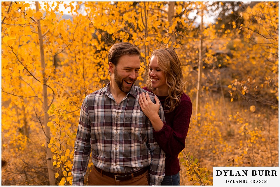 fall engagement photos in colorado couple making him laugh