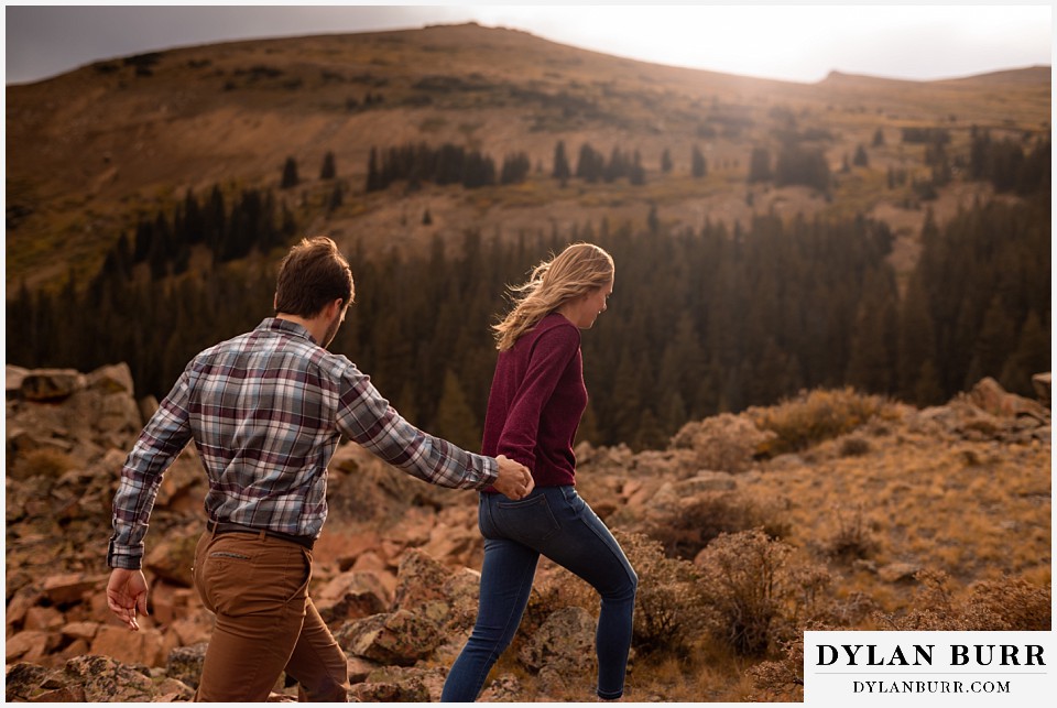 fall engagement photos in colorado couple in mountains in the sunlight