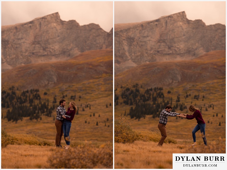 fall engagement photos in colorado couple trying to stand on small rock together
