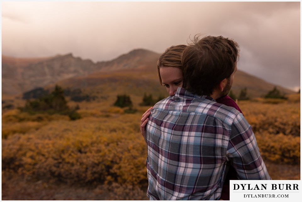 fall engagement photos in colorado  getting in close for a hug