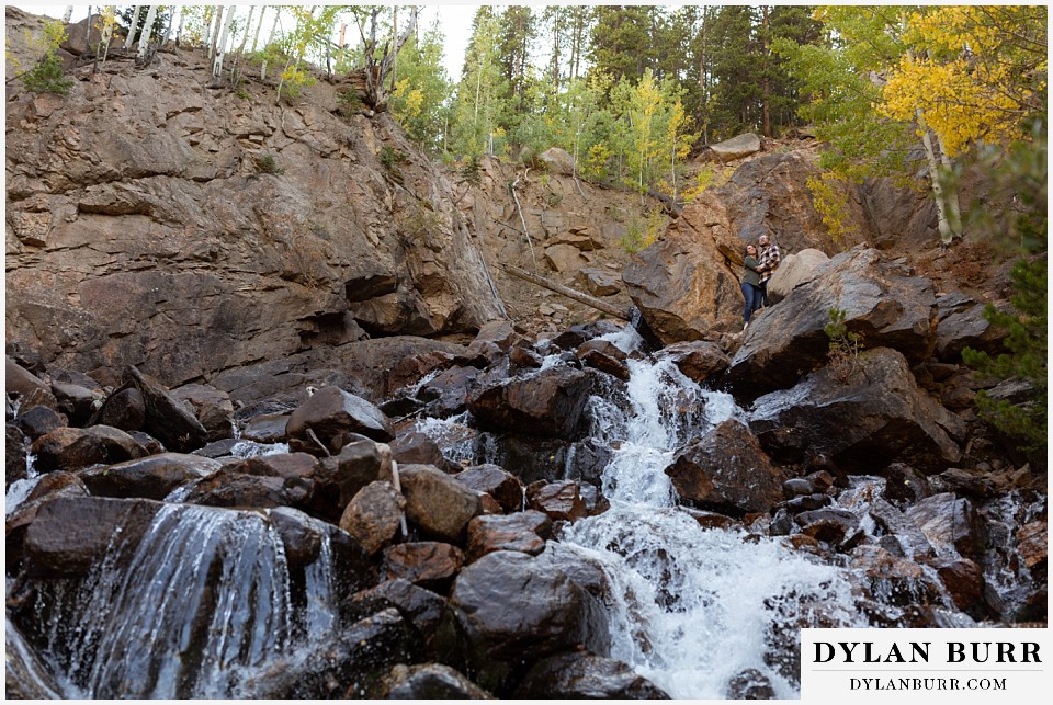 georgetown colorado engagement session couple large rushing waterfall