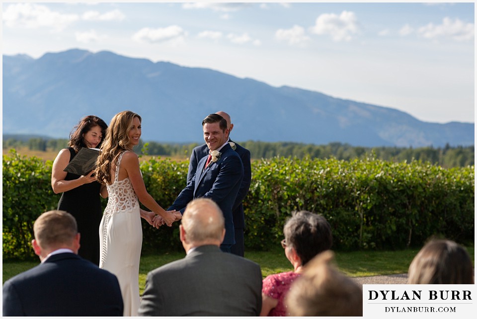 jackson lake lodge wedding grand tetons wyoming bride and groom acknowledging their guests