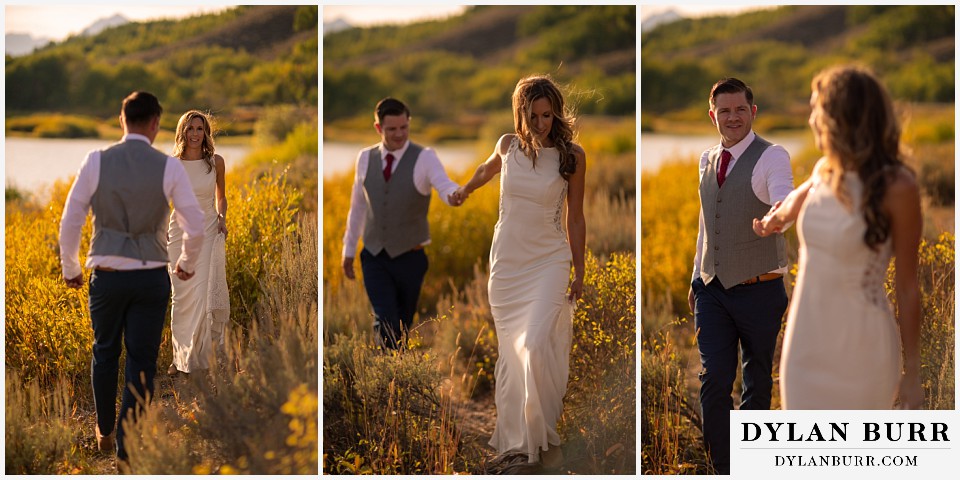jackson lake lodge wedding grand tetons wyoming bride and groom walking together near river