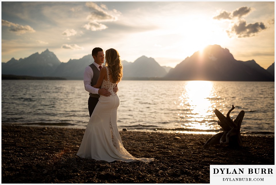 jackson lake lodge wedding grand tetons wyoming groom and his bride in the mountains by the lake
