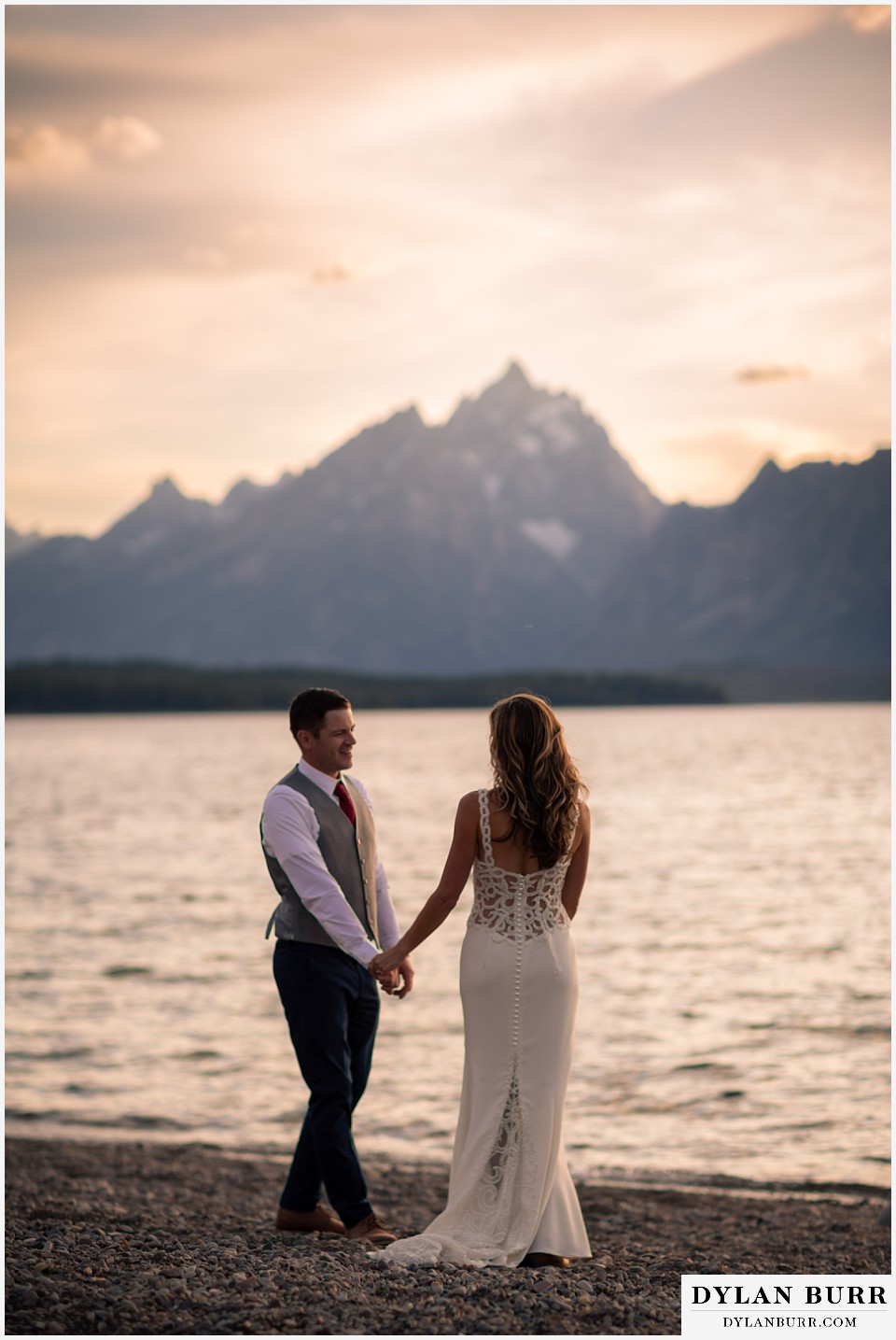 jackson lake lodge wedding grand tetons wyoming bride and groom swaying together with grand teton in background