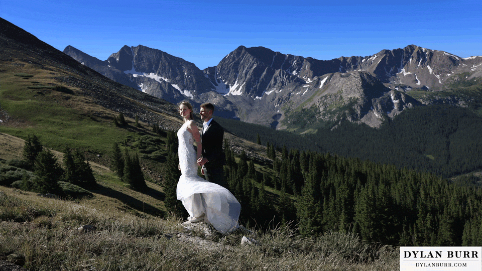 sunrise elopement wedding cinemagraph brides dress waving in the wind