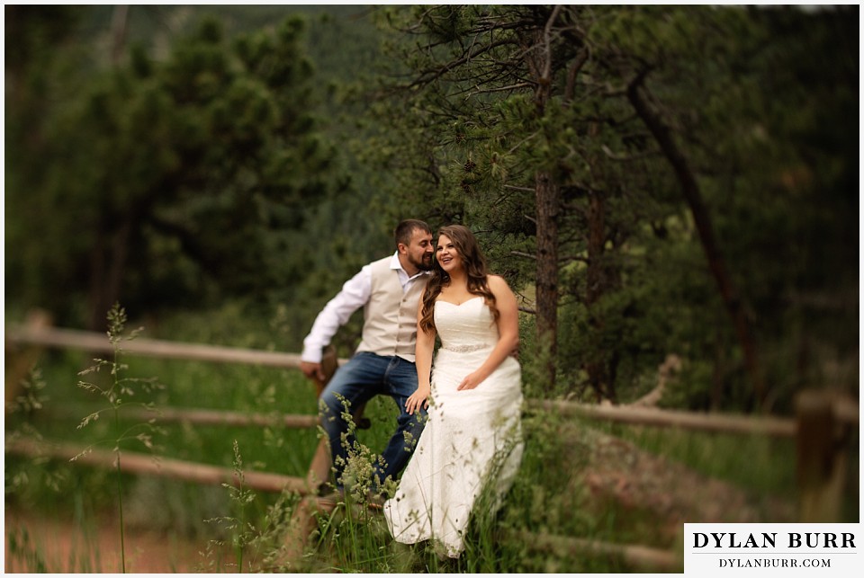 colorado mountain elopement lost gulch overlook wedding boulder co sitting on fence tilt shift