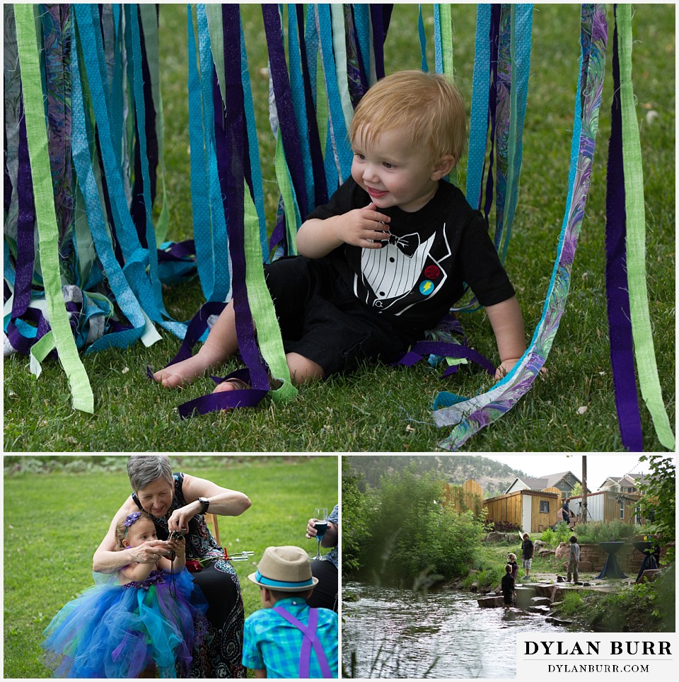 lyons farmette wedding kids playing with grandma in ribbons and creek