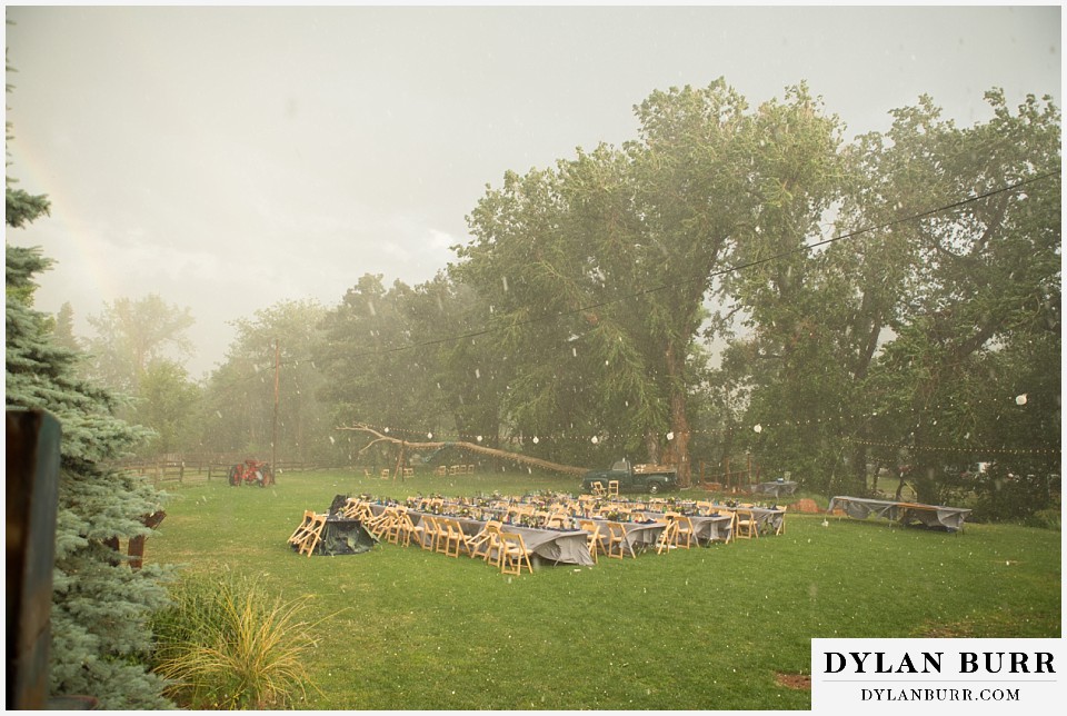 lyons farmette wedding wide view of reception tables in storm