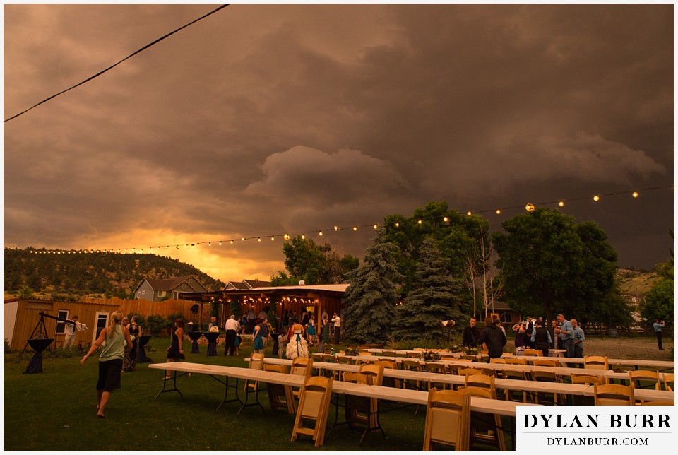 lyons farmette wedding wide view of the farmette with storm clouds and a sunset