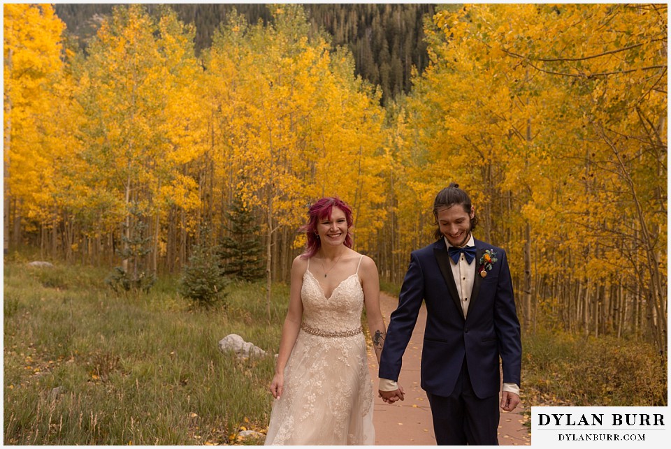 maroon bells wedding aspen colorado mountain wedding fall colorado wedding walking in yellow aspen leaves