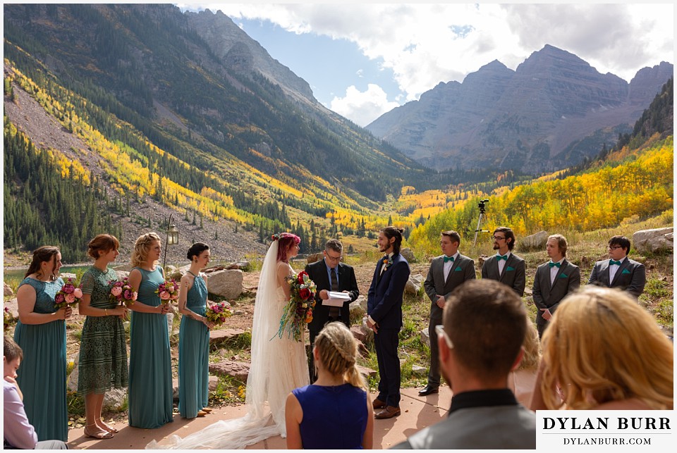 maroon bells wedding aspen colorado mountain wedding party saying vows together