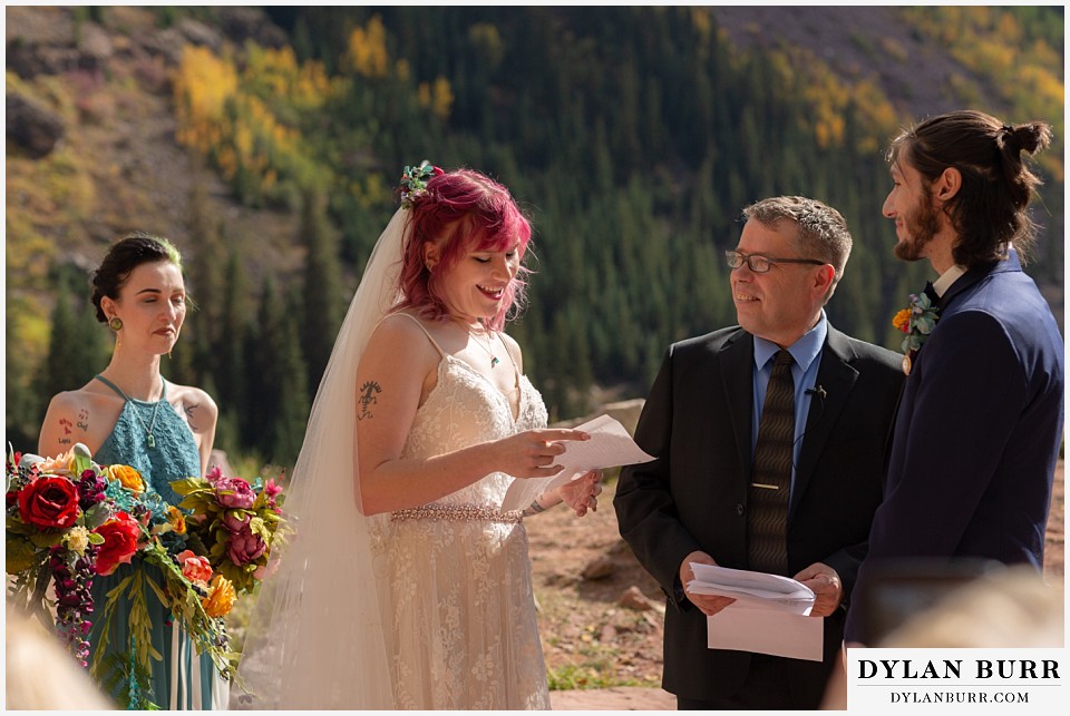 maroon bells wedding aspen colorado mountain wedding bride reading vows to groom