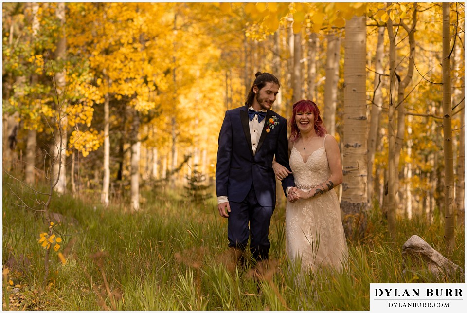 maroon bells wedding aspen colorado mountain wedding bride laughing in yellow aspen trees