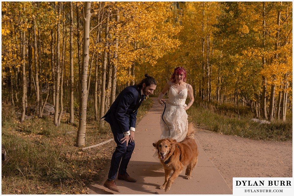 maroon bells wedding aspen colorado mountain wedding bride and groom running with golden retriever