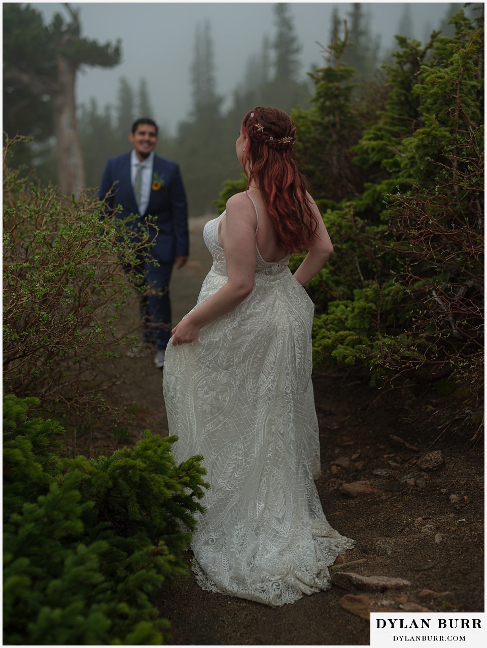 mount blue sky elopement wedding bride walking through the trees in the foggy mountains