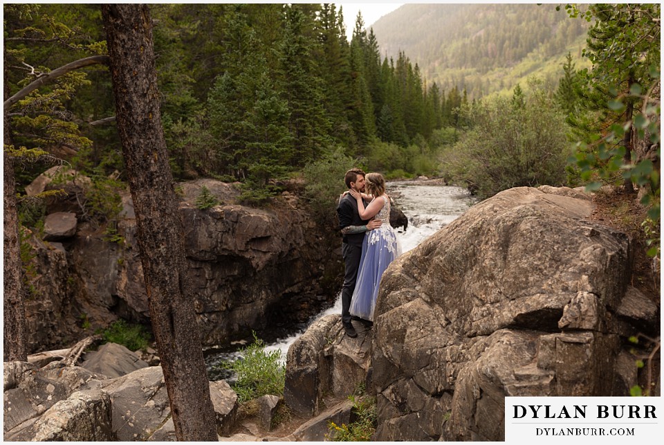mountain adventure elopement wedding colorado bride and grooms first kiss
