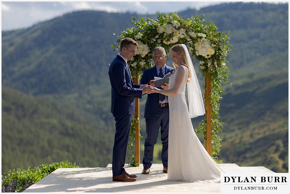 personal mountain home colorado wedding exchanging rings
